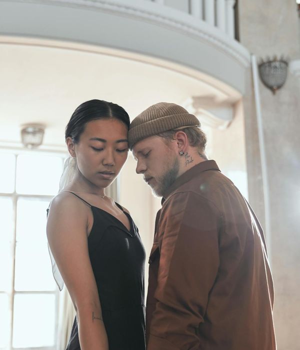 Woman performing a gentle cardio movement in a calm studio environment.